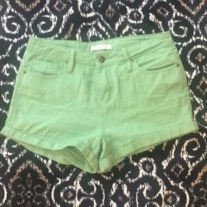 Bright green high waisted shorts